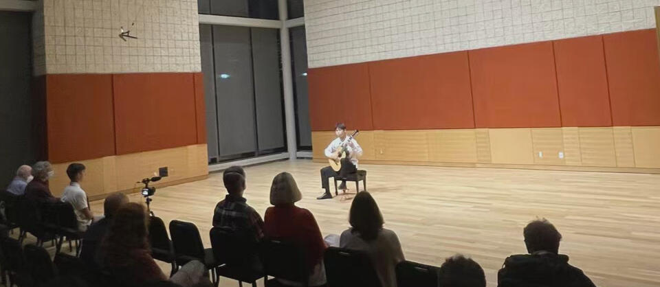 Jiujiu Wu performing a classical guitar at the Boston Guitar Fest 2022