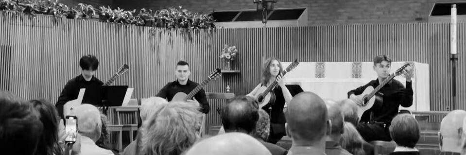 Jiujiu Wu with the New England Conservatory Guitar Ensemble performing a classical guitar quintet at the opening concert for David Russell