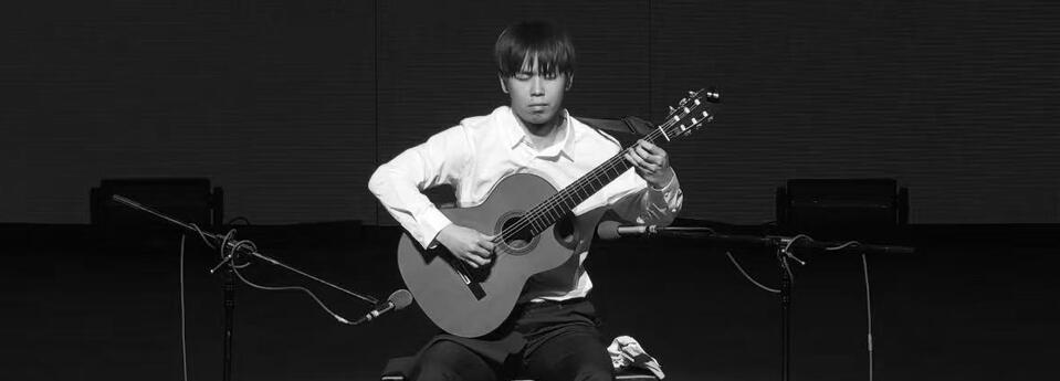 Jiujiu Wu performing classical guitar at the Qingdao International Guitar Festival Competition Jiujiu Wu performing classical guitar at the Qingdao International Guitar Festival Competition