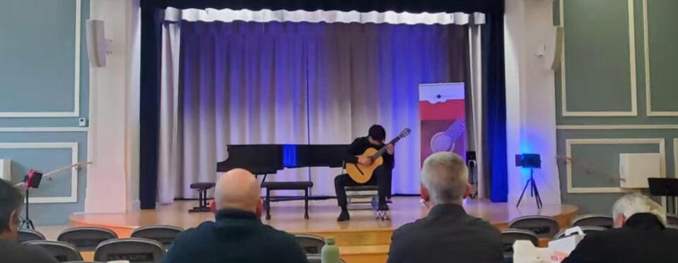 Jiujiu Wu performing classical guitar at the Philadelphia Guitar Competition